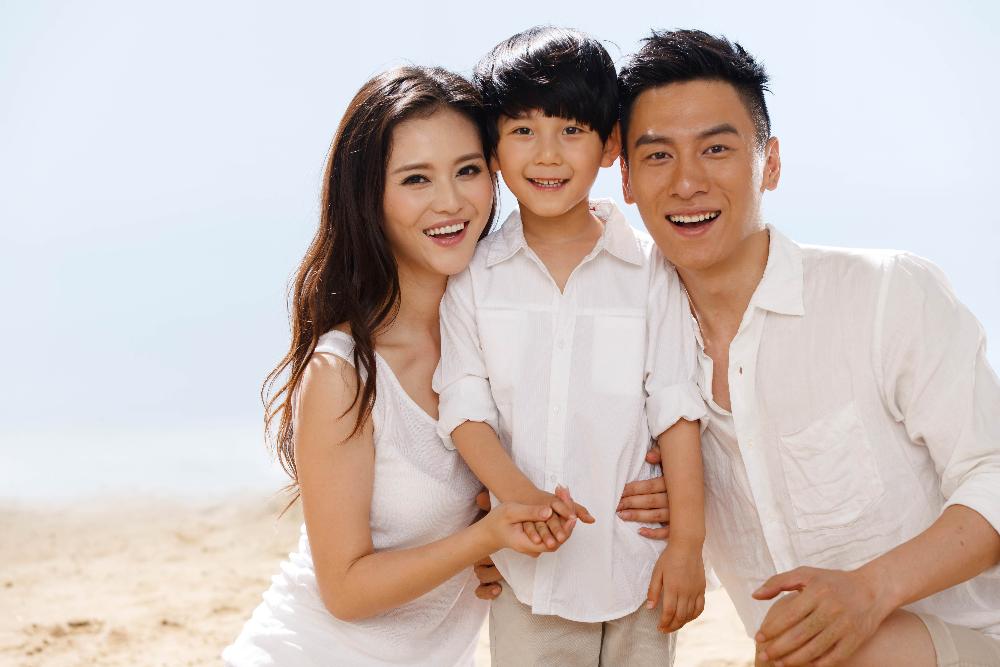 asian family of three smiling | general dentist mesquite tx