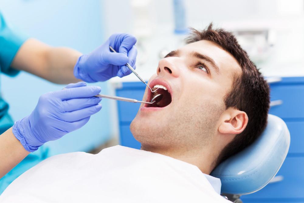 man getting a root canal in Mesquite office