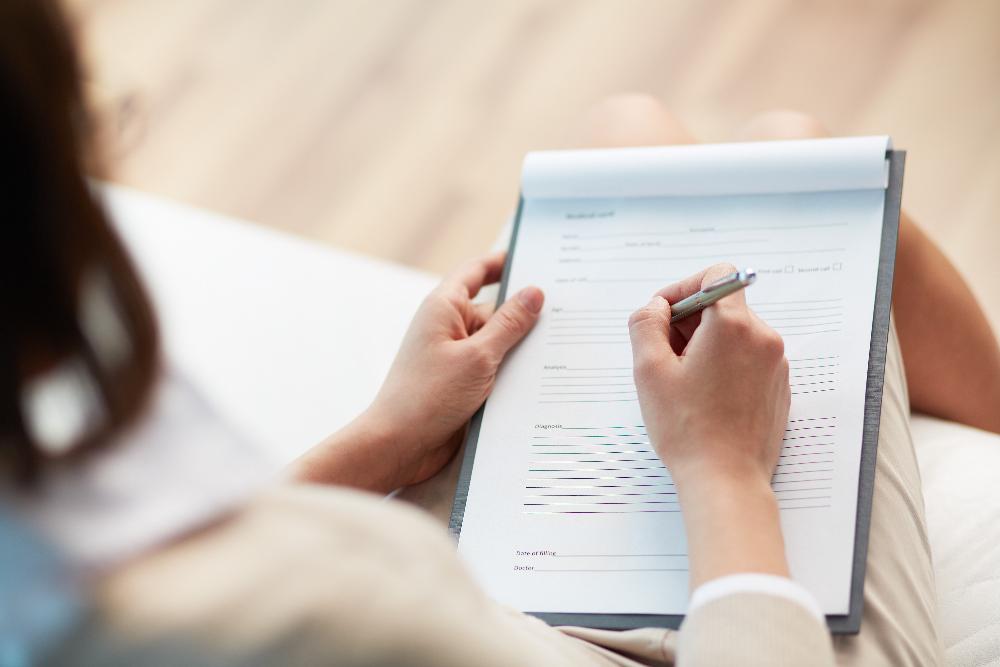 patient writing in journal | dentist mesquite tx
