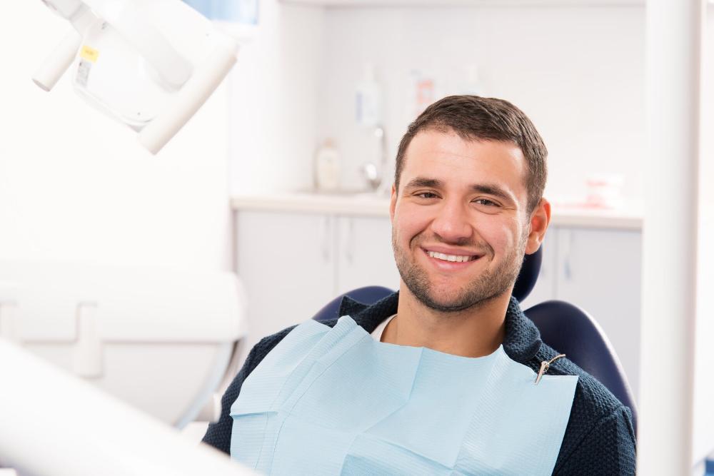 man smiling in dental chair
