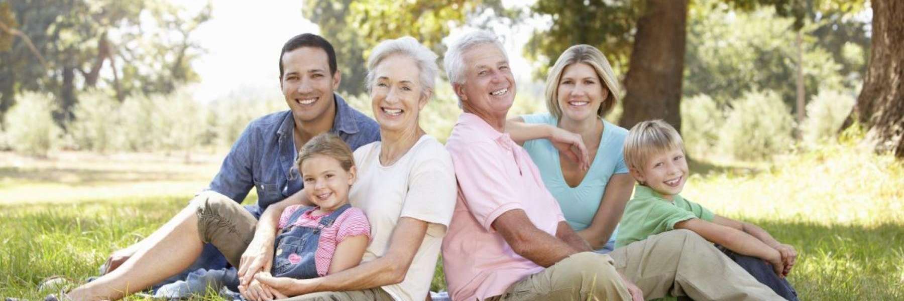 multigenerational family sitting in a park in mesquite tx