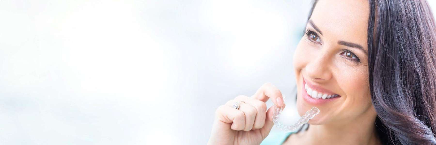 invisalign mesquite | woman with clear aligners