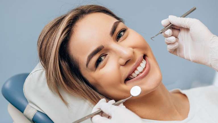 woman smiling in mesquite dental chair