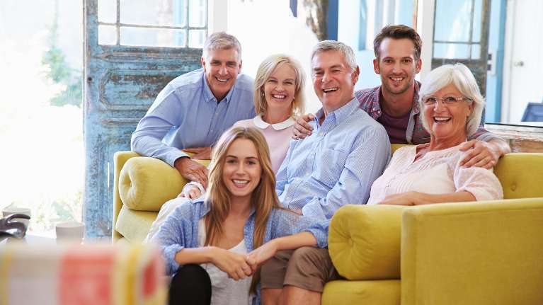 cosmetic dentistry mesquite | multigenerational family sitting on the couch