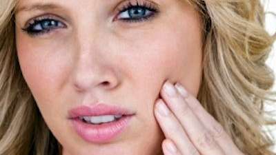 mesquite woman holding jaw from pain