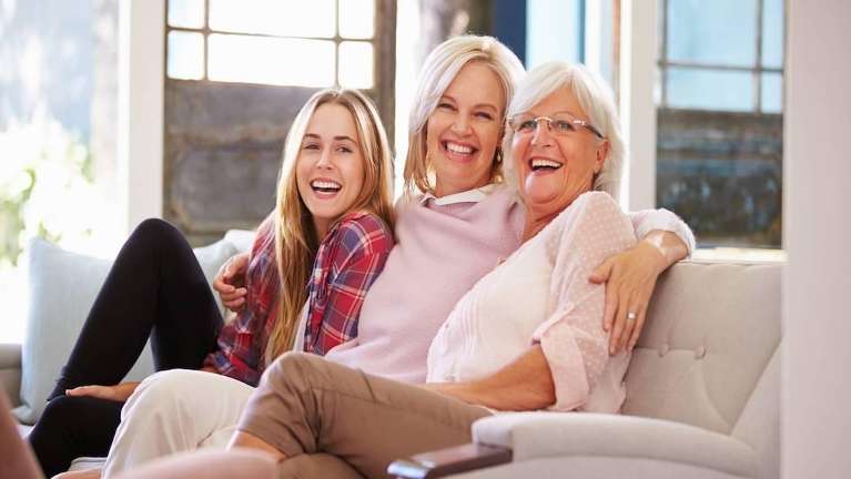 mom, grandmother, and daughter smiling in mesquite 