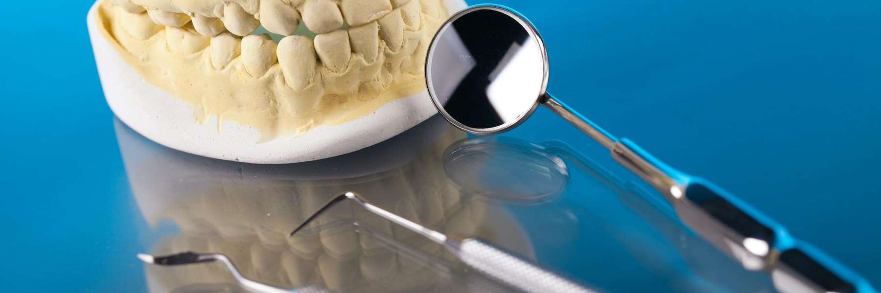 close up of dental tool and mouth mold | dentist mesquite tx