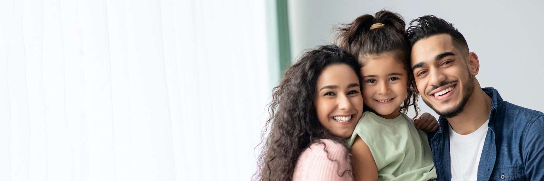 family of three hugging | dentist mesquite tx