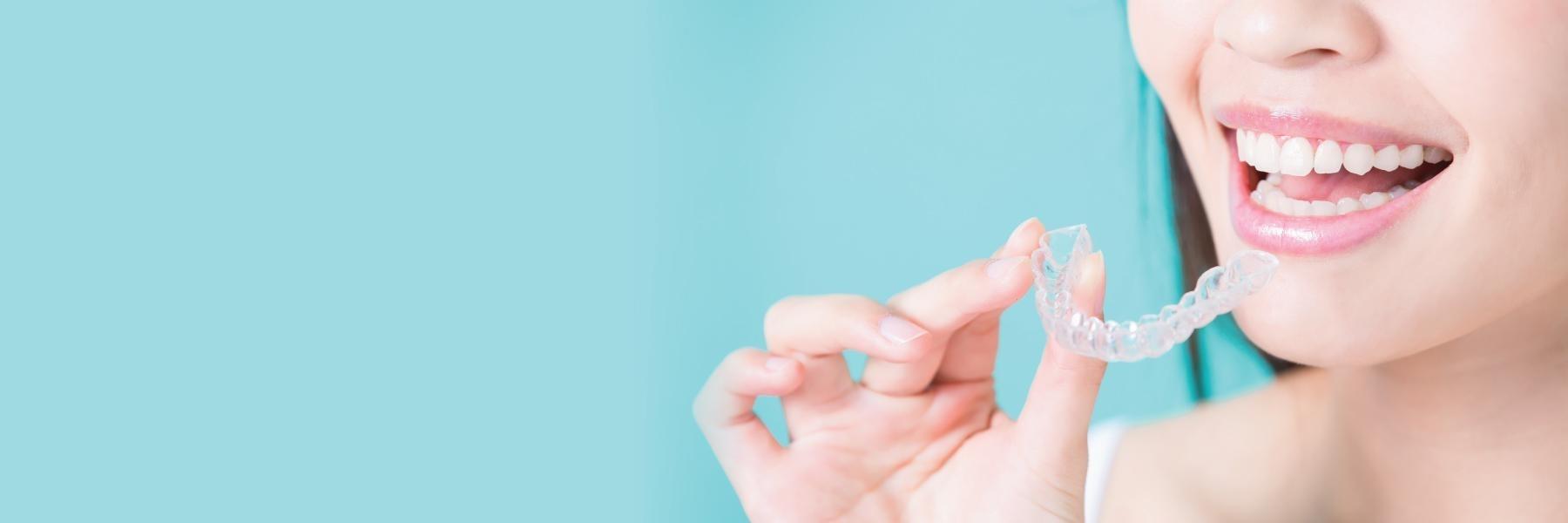 woman using Invisalign in mesquite
